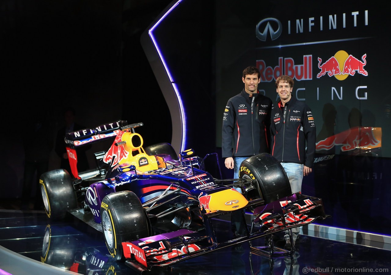 RED BULL RB9, MILTON KEYENES, ENGLAND - FEBRUARY 03:  Drivers Mark Webber of Australia (L) e Sebastian Vettel of Germany pose along side the new car during the Infiniti Red Bull Racing RB9 launch on February 3, 2013 in Milton Keyenes, England.  (Photo by Richard Heathcote/Getty Images)