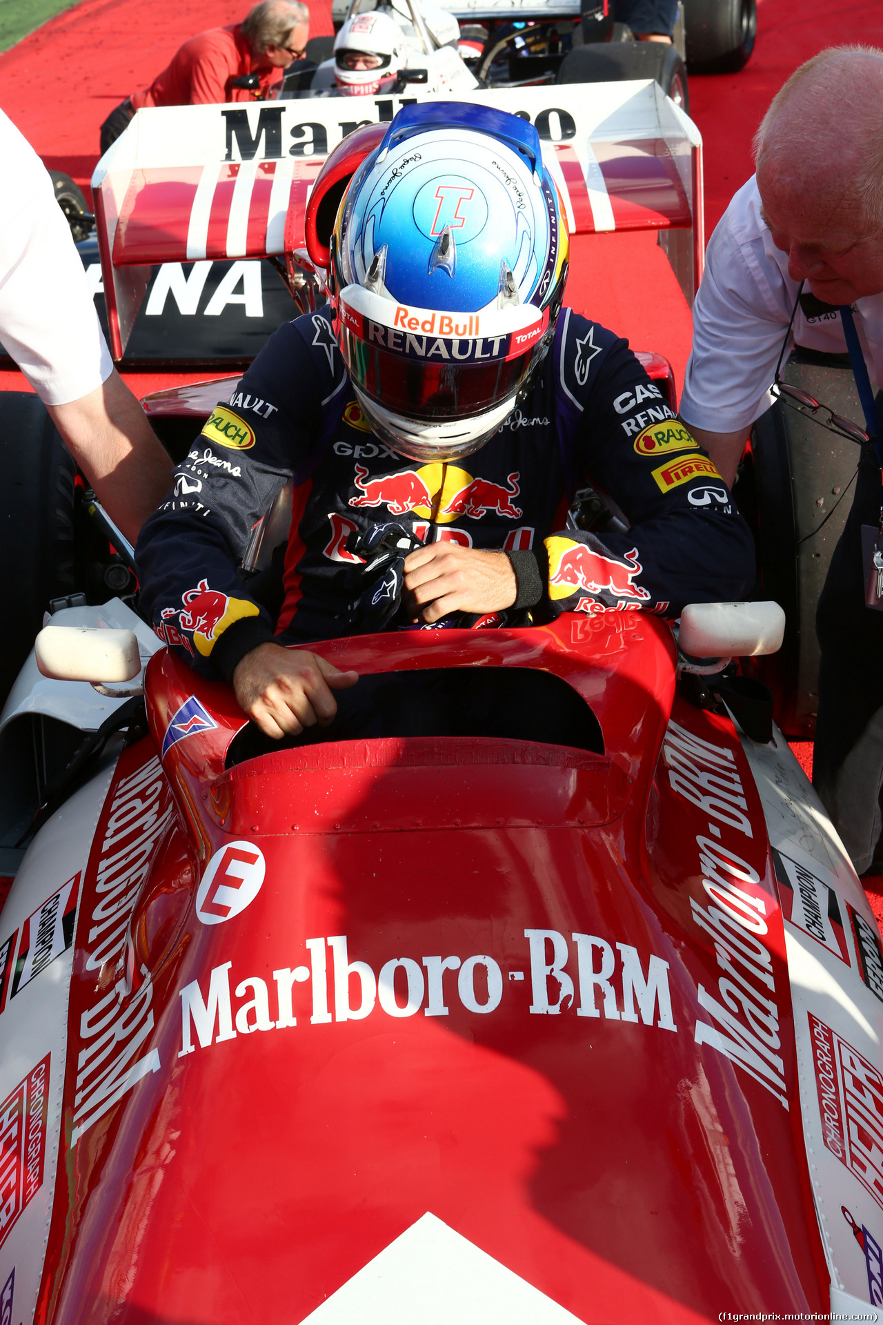 GP AUSTRIA, 21.06.2014- Sebastian Vettel (GER) Red Bull Racing with the BRM P160 once driven by Dr Helmut Marko (AUT) Red Bull Motorsport Consultant.