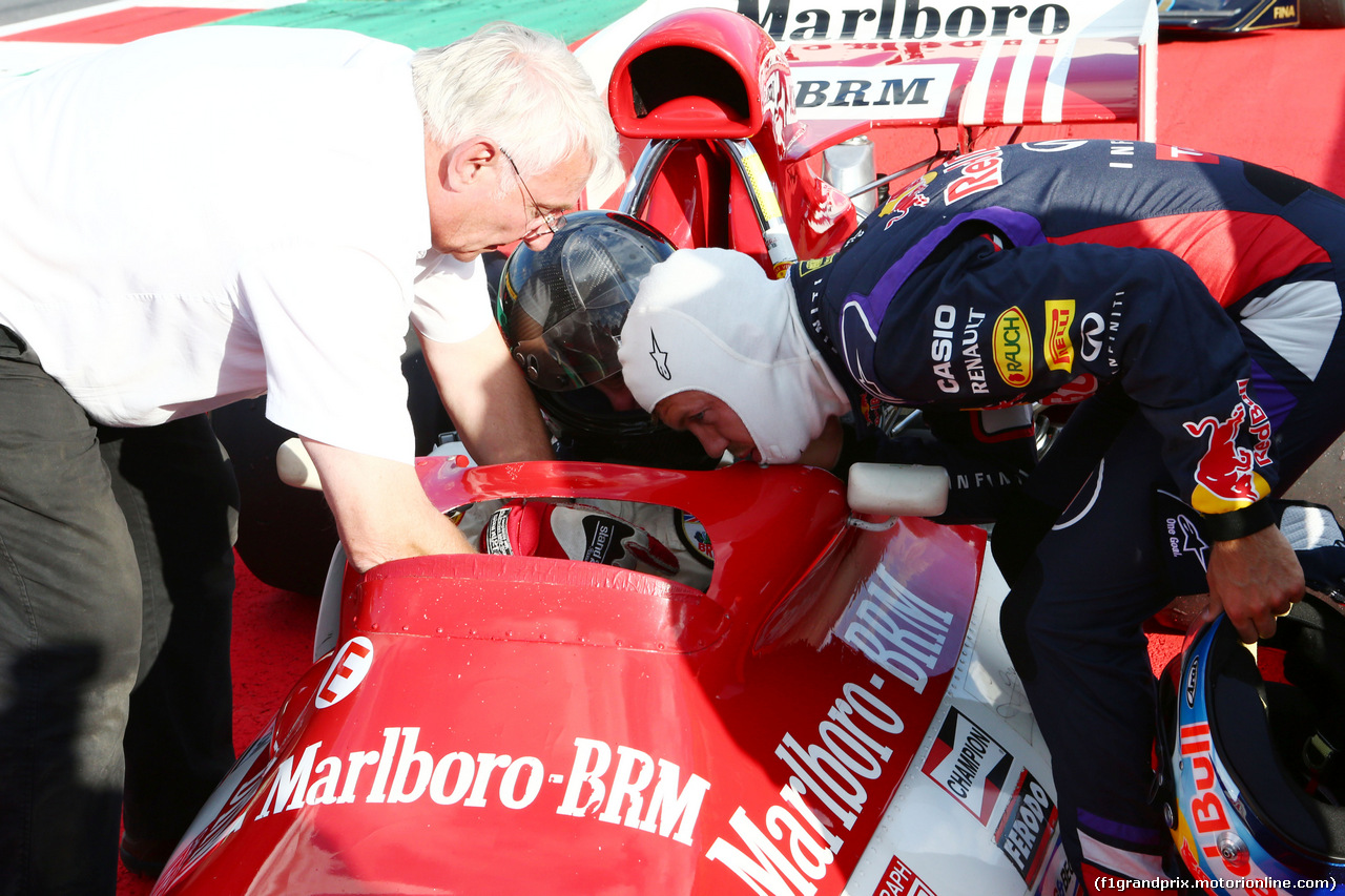 GP AUSTRIA, 21.06.2014- Sebastian Vettel (GER) Red Bull Racing with the BRM P160 once driven by Dr Helmut Marko (AUT) Red Bull Motorsport Consultant.