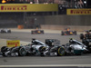 GP BAHRAIN, 06.04.2014- Gara, Lewis Hamilton (GBR) Mercedes AMG F1 W05 fighting with Nico Rosberg (GER) Mercedes AMG F1 W05