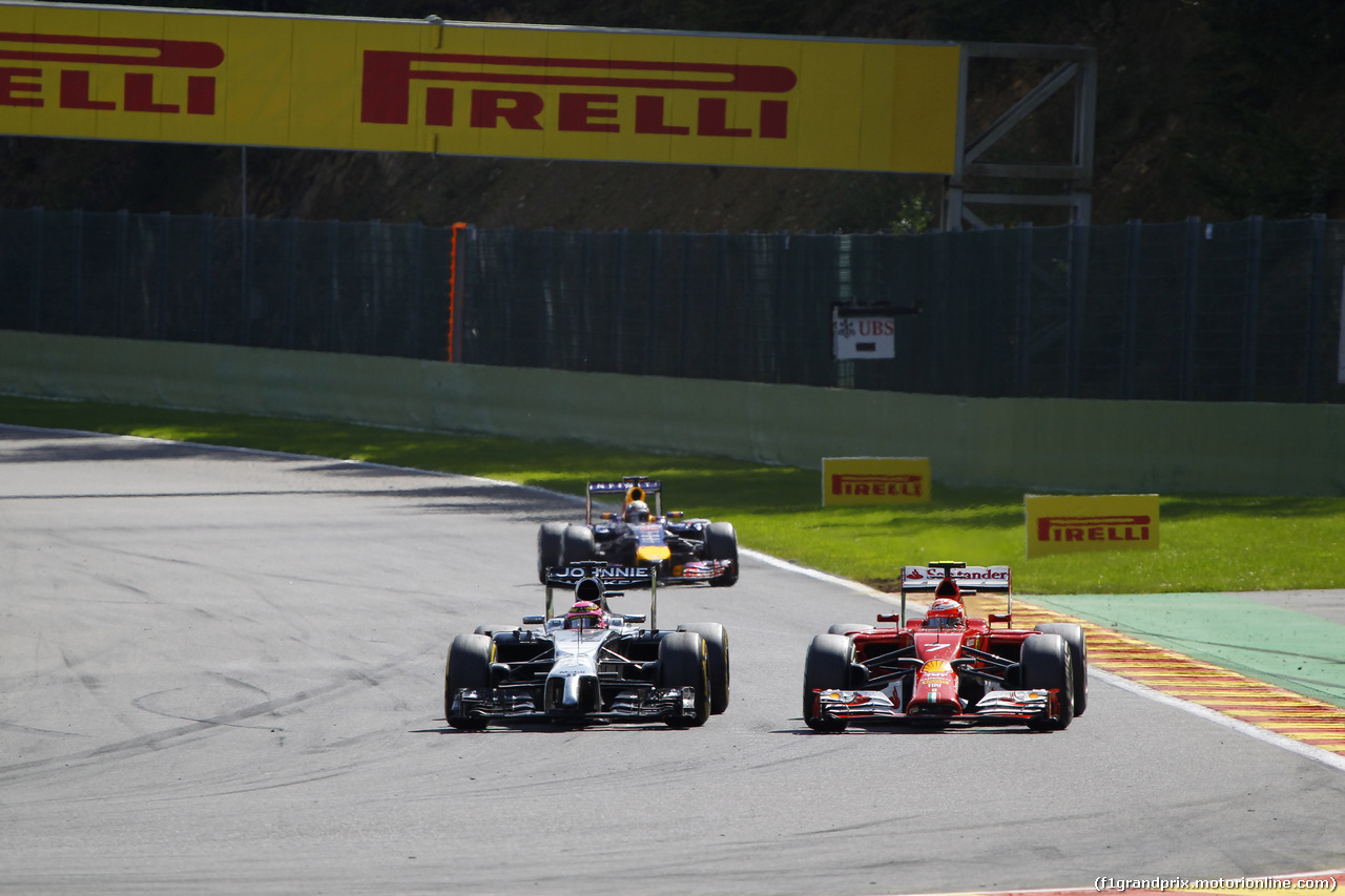 GP BELGIO, 24.08.2014- Gara, Kimi Raikkonen (FIN) Ferrari F14-T e Jenson Button (GBR) McLaren Mercedes MP4-29