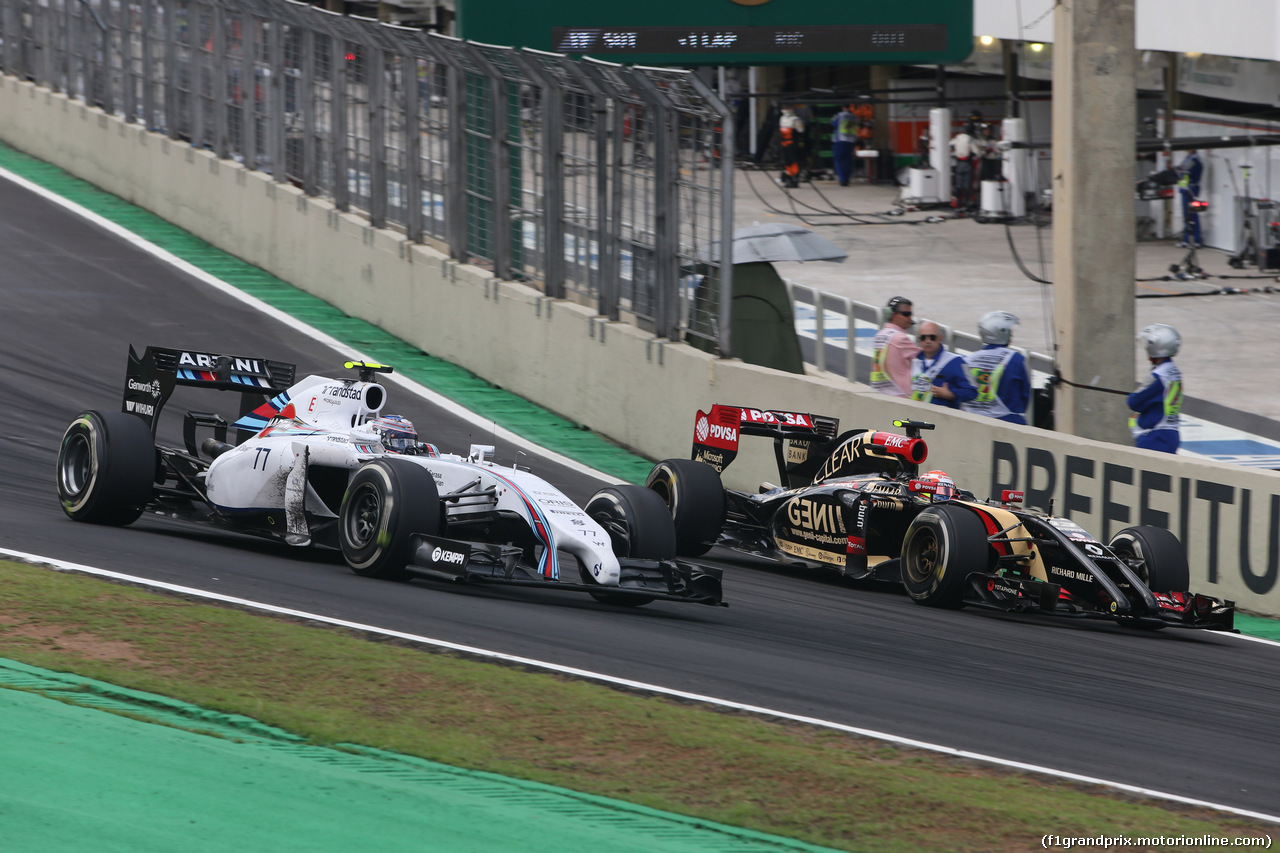 GP BRASILE, 09.11.2014 - Gara, Valtteri Bottas (FIN) Williams F1 Team FW36 e Pastor Maldonado (VEN) Lotus F1 Team E22