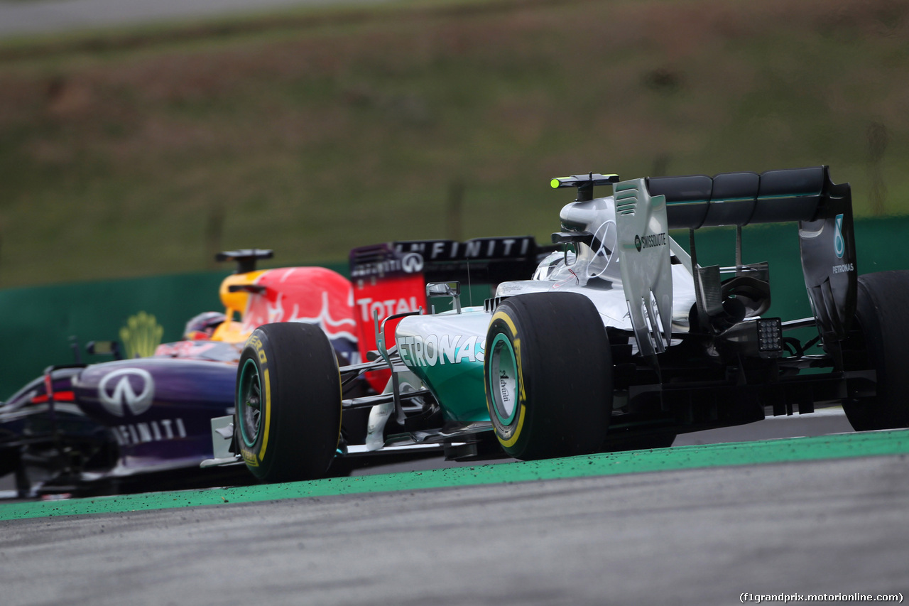 GP BRASILE, 08.11.2014 - Prove Libere 3, Sebastian Vettel (GER) Red Bull Racing RB10 e Nico Rosberg (GER) Mercedes AMG F1 W05