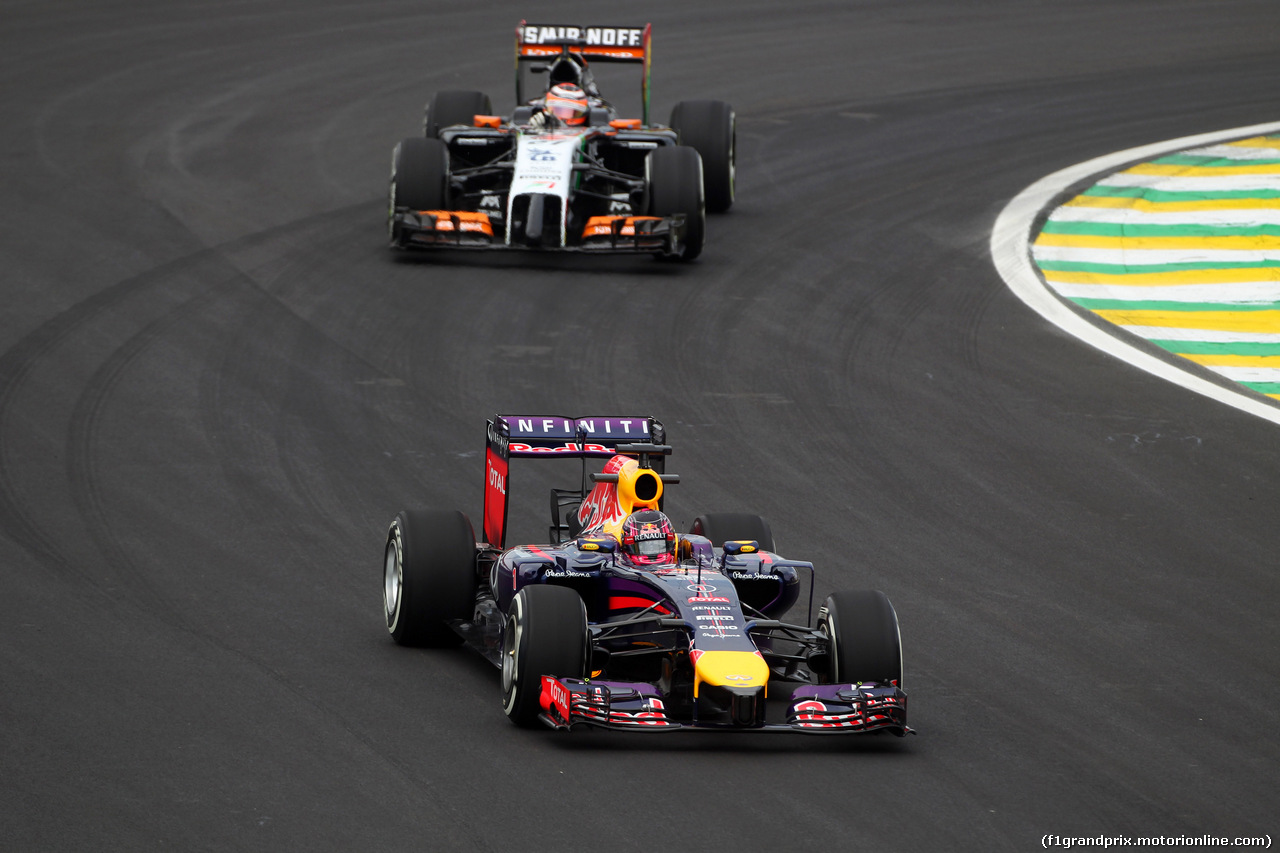 GP BRASILE, 07.11.2014 - Prove Libere 1, Sebastian Vettel (GER) Red Bull Racing RB10 davanti a Nico Hulkenberg (GER) Sahara Force India F1 VJM07