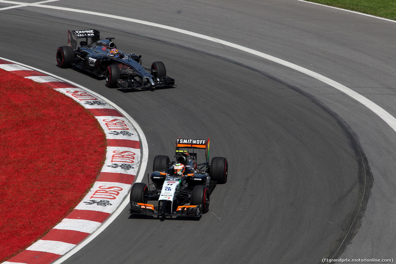 GP CANADA, 08.06.2014- Gara, Sergio Perez (MEX) Sahara Force India F1 VJM07 davanti a Jenson Button (GBR) McLaren Mercedes MP4-29