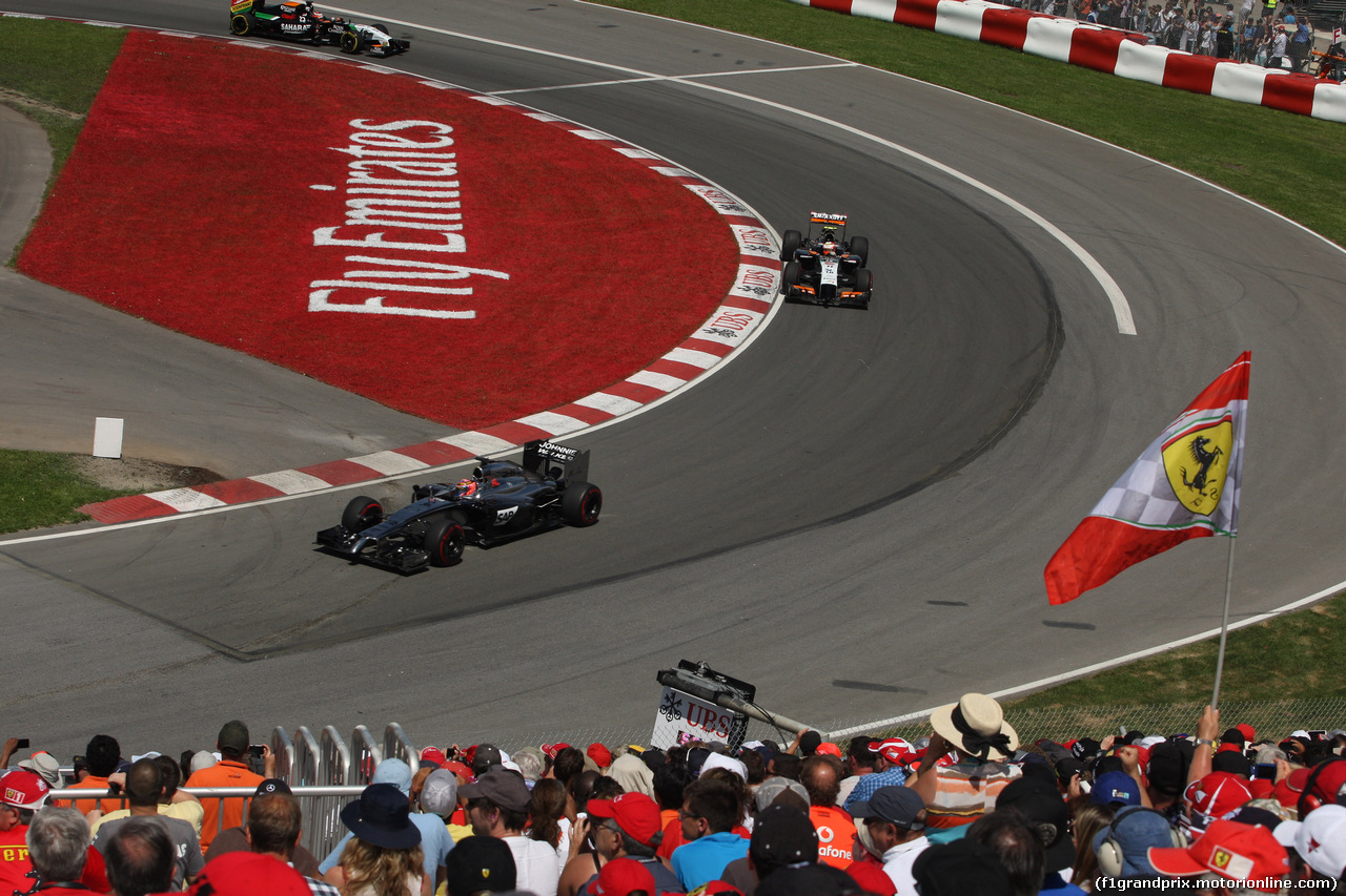 GP CANADA, 08.06.2014- Gara, Jenson Button (GBR) McLaren Mercedes MP4-29 davanti a Sergio Perez (MEX) Sahara Force India F1 VJM07