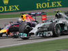 GP CINA, 20.04.2014- Gara, Nico Rosberg (GER) Mercedes AMG F1 W05 overtaking Sebastian Vettel (GER) Infiniti Red Bull Racing RB10