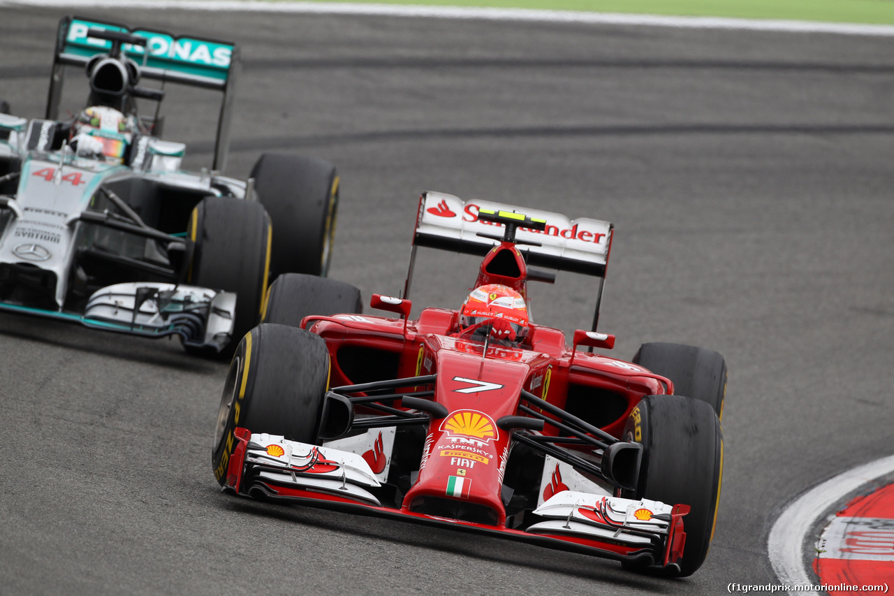 GP GERMANIA, 20.07.2014- Gara, the fight btween Kimi Raikkonen (FIN) Ferrari F14T e Lewis Hamilton (GBR) Mercedes AMG F1 W05