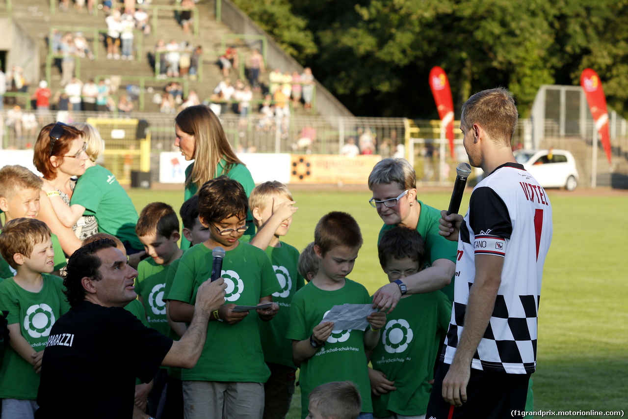 GP GERMANIA, Sebastian Vettel (GER) Red Bull Racing ist talking with kids, Kick f¸r Kinder at Hanau. 
16.07.2014. Formula 1 World Championship, Rd 10, German Grand Prix, Hockenheim, Germany, Wednesday Soccer.