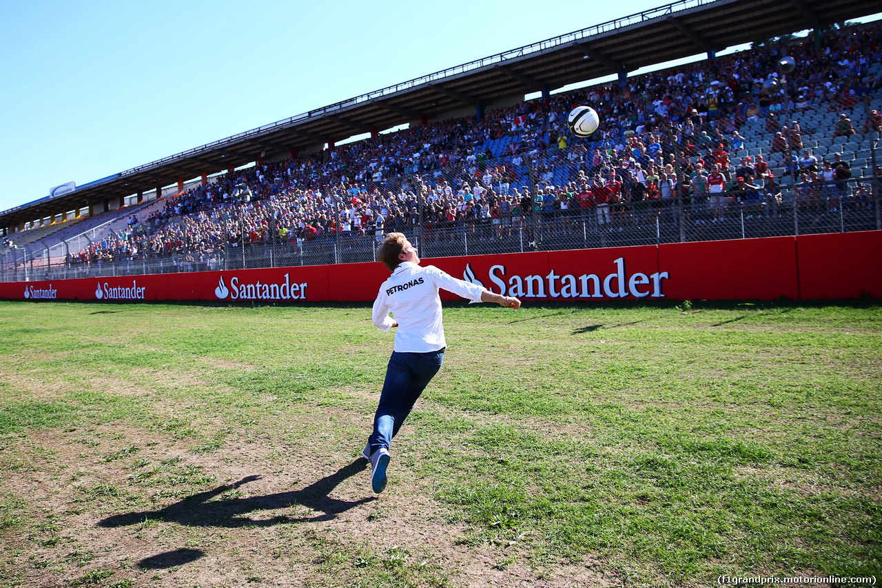 GP GERMANIA, Nico Rosberg (GER) Mercedes AMG F1 plays football on the partenza/finish straight.
17.07.2014. Formula 1 World Championship, Rd 10, German Grand Prix, Hockenheim, Germany, Preparation Day.