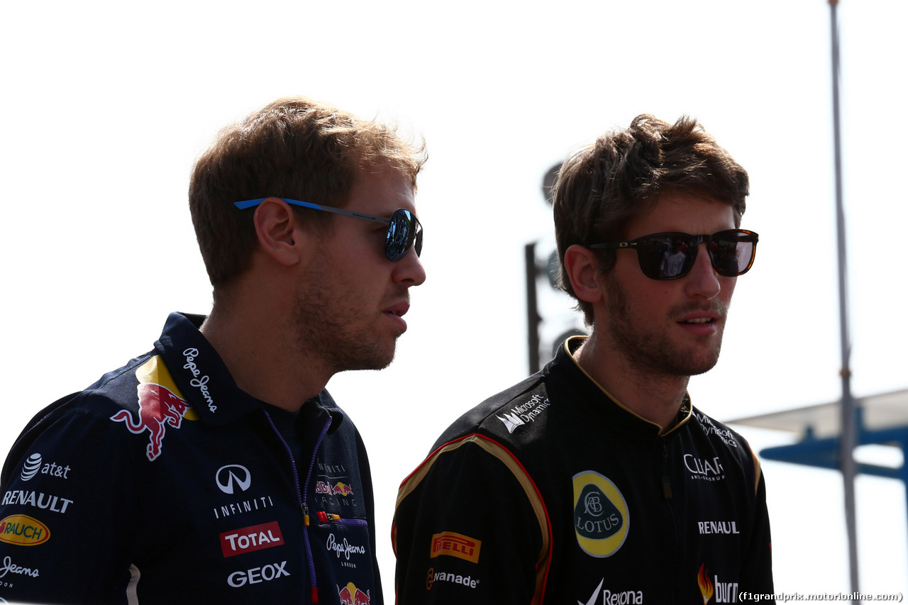 GP ITALIA, 07.09.2014 - Sebastian Vettel (GER) Red Bull Racing RB10 e Romain Grosjean (FRA) Lotus F1 Team E22