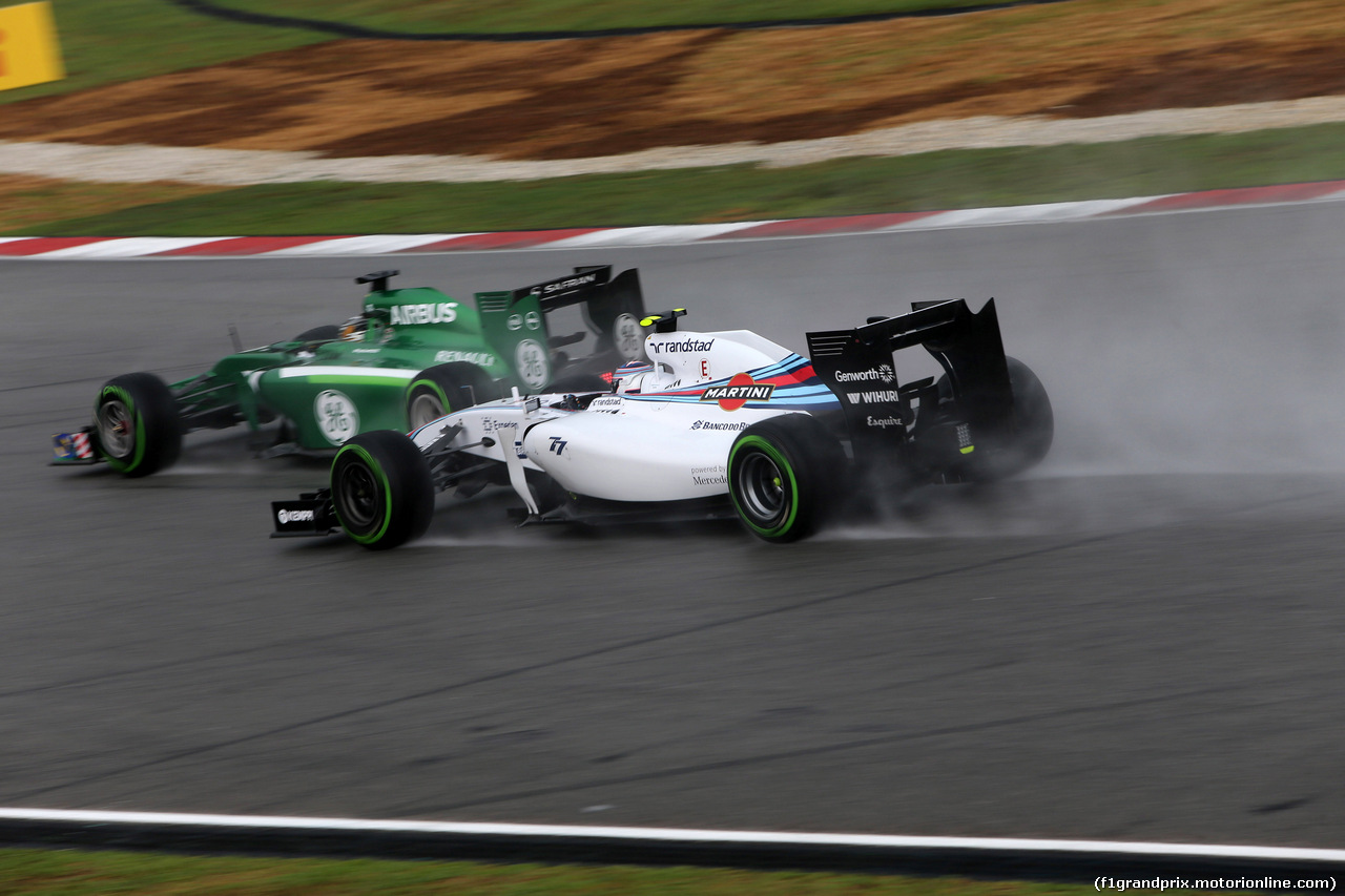 GP MALESIA, 29.03.2014- Qualifiche, Kamui Kobayashi (JAP) Caterham F1 Team CT-04 e Valtteri Bottas (FIN) Williams F1 Team FW36