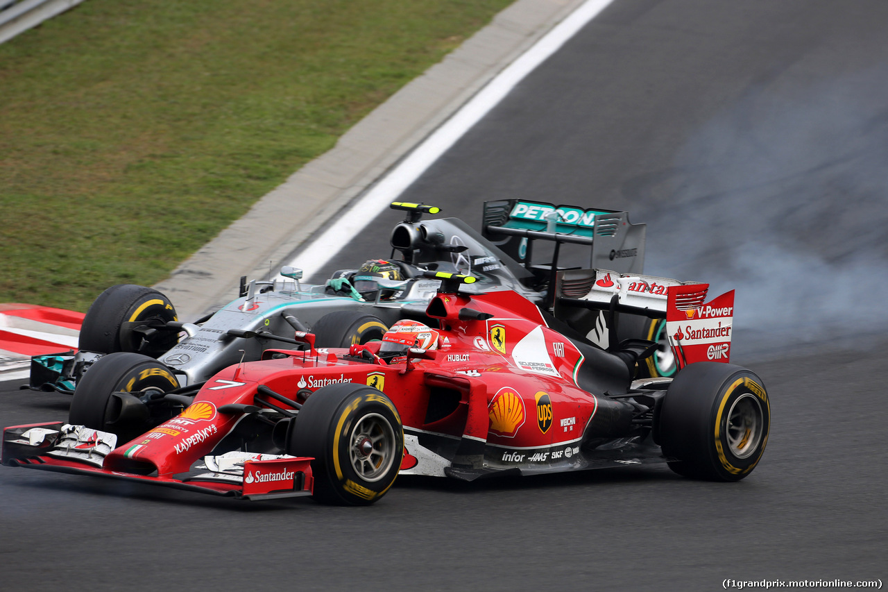 GP UNGHERIA, 27.07.2014- Gara, Kimi Raikkonen (FIN) Ferrari F14-T e Nico Rosberg (GER) Mercedes AMG F1 W05