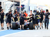 TEST F1 BAHRAIN 19 FEBBRAIO, The Red Bull Racing RB10 of Sebastian Vettel (GER) Red Bull Racing is pushed back down the pit lane by meccanici.
19.02.2014. Formula One Testing, Bahrain Test One, Day One, Sakhir, Bahrain.