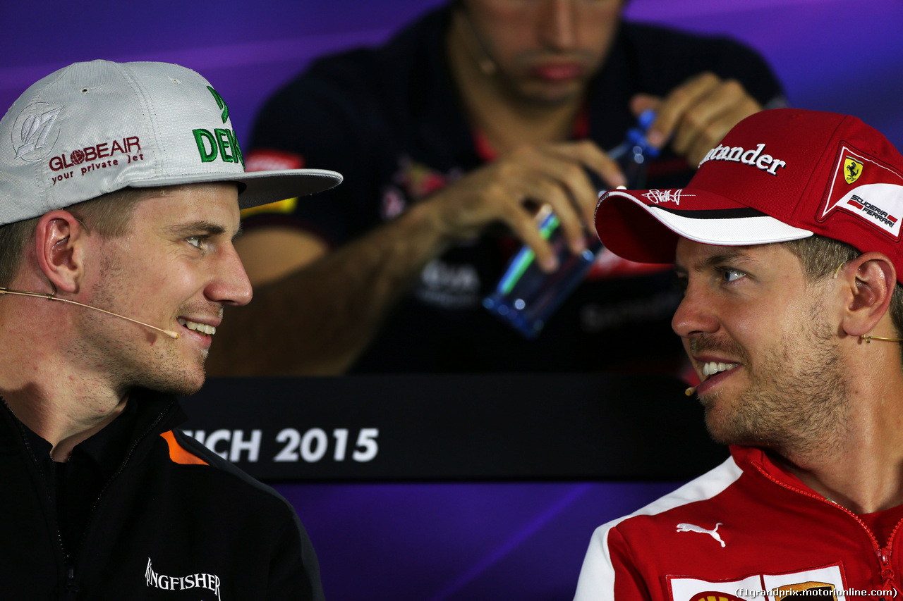 GP AUSTRIA, (L to R): Nico Hulkenberg (GER) Sahara Force India F1 with Sebastian Vettel (GER) Ferrari in the FIA Press Conference.
18.06.2015.