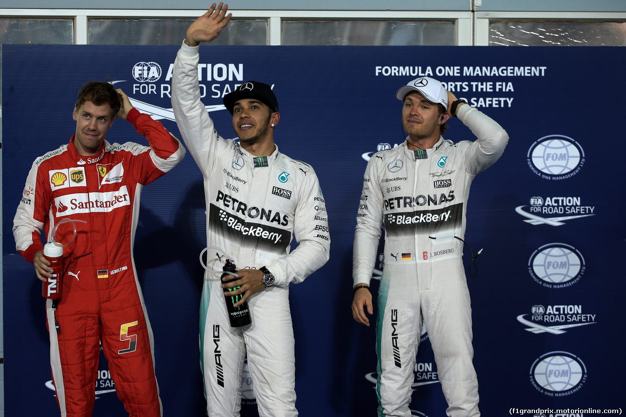 GP BAHRAIN, 18.04.2015 - Qualifiche, Lewis Hamilton (GBR) Mercedes AMG F1 W06 pole position, secondo Sebastian Vettel (GER) Ferrari SF15-T e terzo Nico Rosberg (GER) Mercedes AMG F1 W06