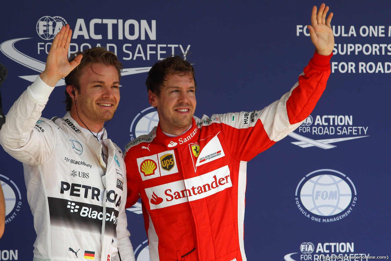 GP BRASILE, 14.11.2015 - Qualifiche, Nico Rosberg (GER) Mercedes AMG F1 W06 pole position e terzo Sebastian Vettel (GER) Ferrari SF15-T