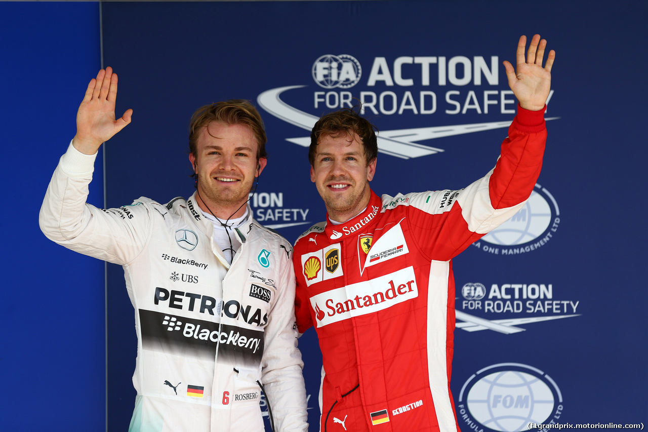 GP BRASILE, 14.11.2015 - Qualifiche, Nico Rosberg (GER) Mercedes AMG F1 W06 pole position e terzo Sebastian Vettel (GER) Ferrari SF15-T