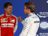 GP BRASILE, 14.11.2015 - Qualifiche, terzo Sebastian Vettel (GER) Ferrari SF15-T e Nico Rosberg (GER) Mercedes AMG F1 W06 pole position