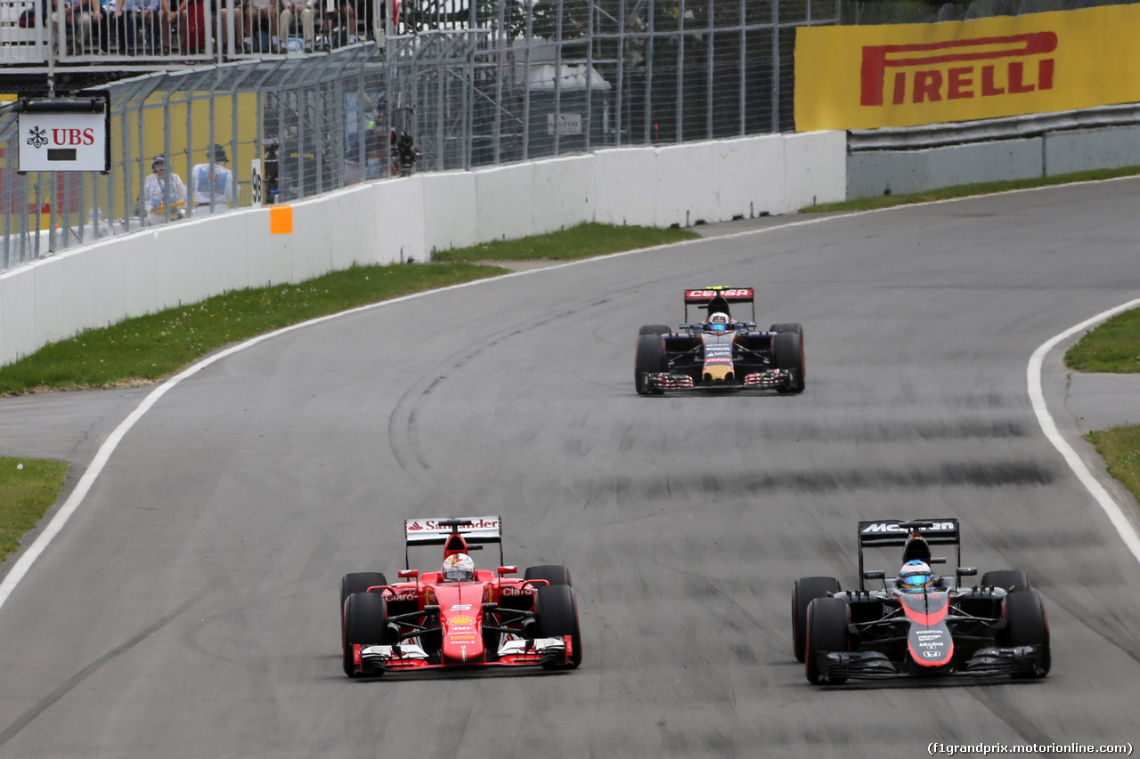 GP CANADA, 07.06.2015 - Gara, Sebastian Vettel (GER) Ferrari SF15-T e Fernando Alonso (ESP) McLaren Honda MP4-30