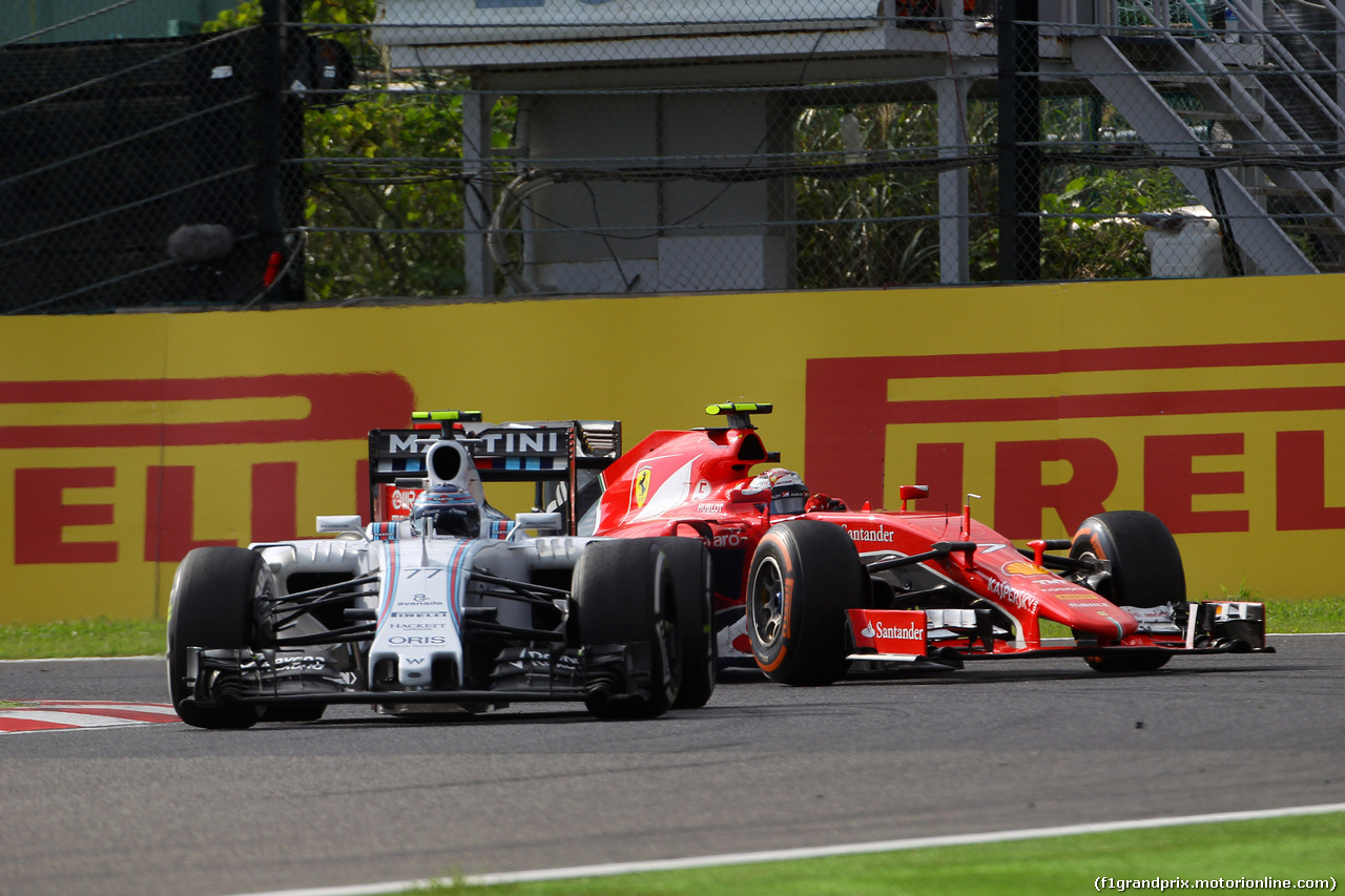 GP GIAPPONE, 27.09.2015 - Gara, Valtteri Bottas (FIN) Williams F1 Team FW37 e Kimi Raikkonen (FIN) Ferrari SF15-T