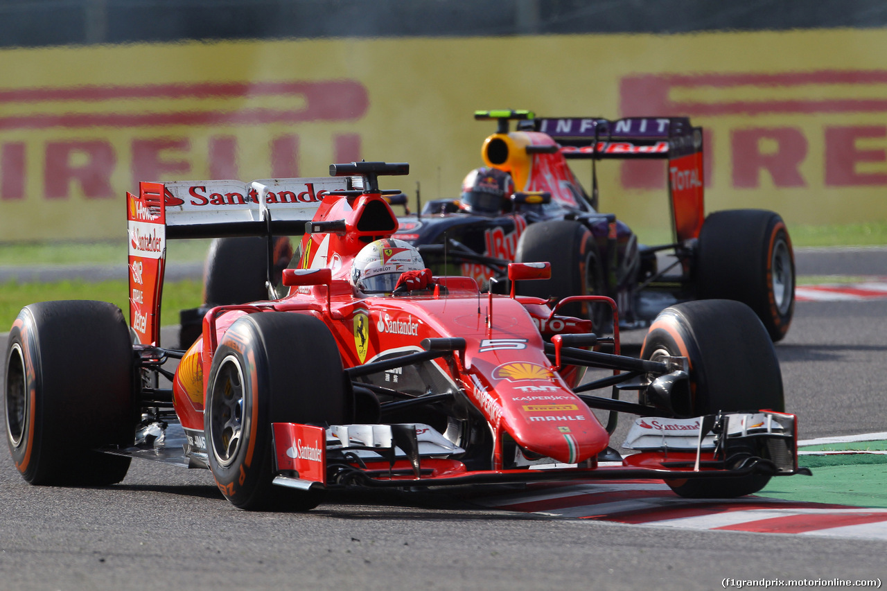 GP GIAPPONE, 27.09.2015 - Gara, Sebastian Vettel (GER) Ferrari SF15-T davanti a Daniil Kvyat (RUS) Red Bull Racing RB11