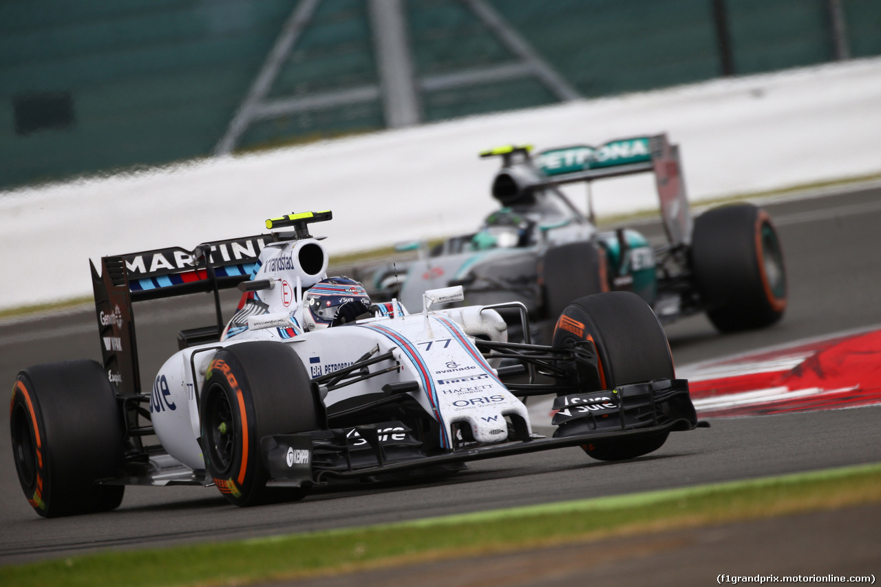 GP GRAN BRETAGNA, 05.07.2015- Gara, Valtteri Bottas (FIN) Williams F1 Team FW37 e Nico Rosberg (GER) Mercedes AMG F1 W06