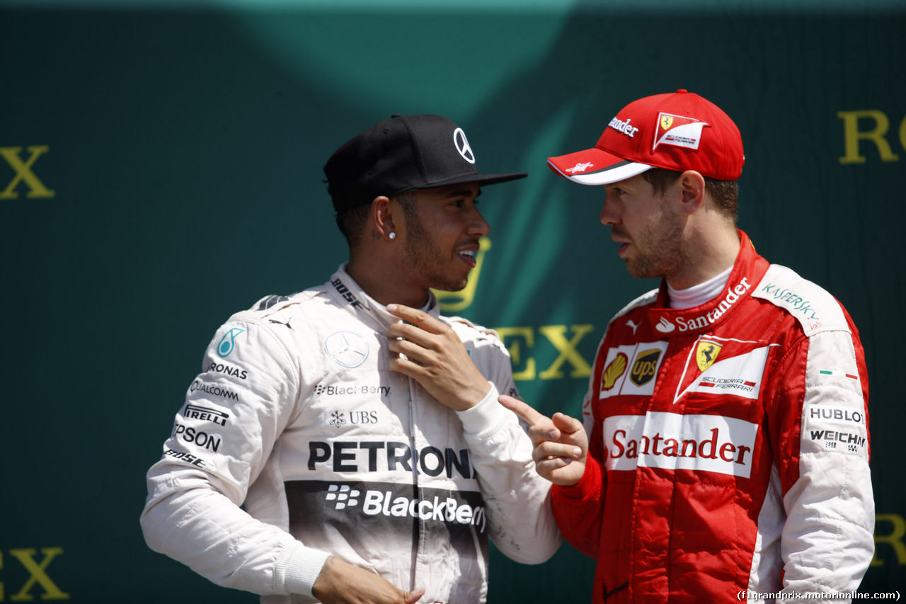 GP GRAN BRETAGNA, 05.07.2015- Gara, 1st position Lewis Hamilton (GBR) Mercedes AMG F1 W06 e terzo Sebastian Vettel (GER) Ferrari SF15-T