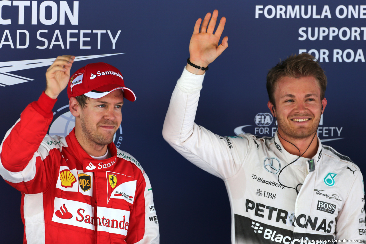 GP SPAGNA, 09.05.2015 - Qualifiche, terzo Sebastian Vettel (GER) Ferrari SF15-T e Nico Rosberg (GER) Mercedes AMG F1 W06 pole position