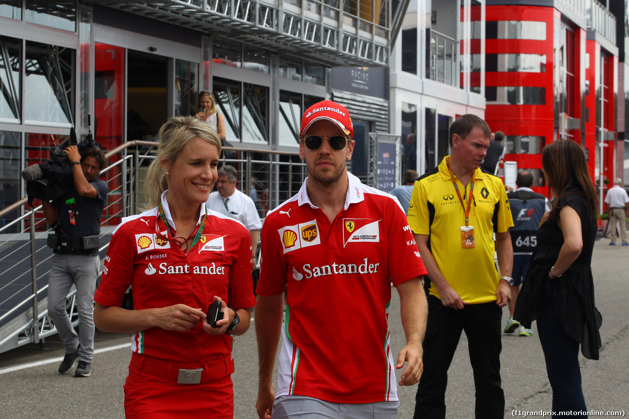 GP GERMANIA, 28.07.2016 - Britta Roeske (AUT) Ferrari Press Officer. e Sebastian Vettel (GER) Ferrari SF16-H