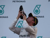 GP MALESIA, 02.10.2016 - Gara, terzo Nico Rosberg (GER) Mercedes AMG F1 W07 Hybrid drinks champagne with the shoe of Daniel Ricciardo (AUS) Red Bull Racing RB12