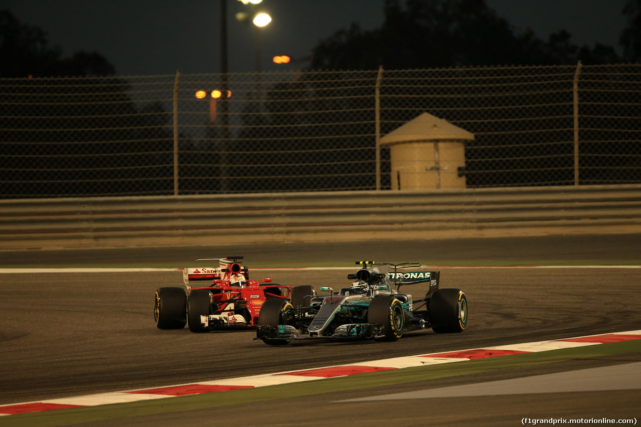 GP BAHRAIN, 14.04.2017 - Prove Libere 2, Sebastian Vettel (GER) Ferrari SF70H e Valtteri Bottas (FIN) Mercedes AMG F1 W08