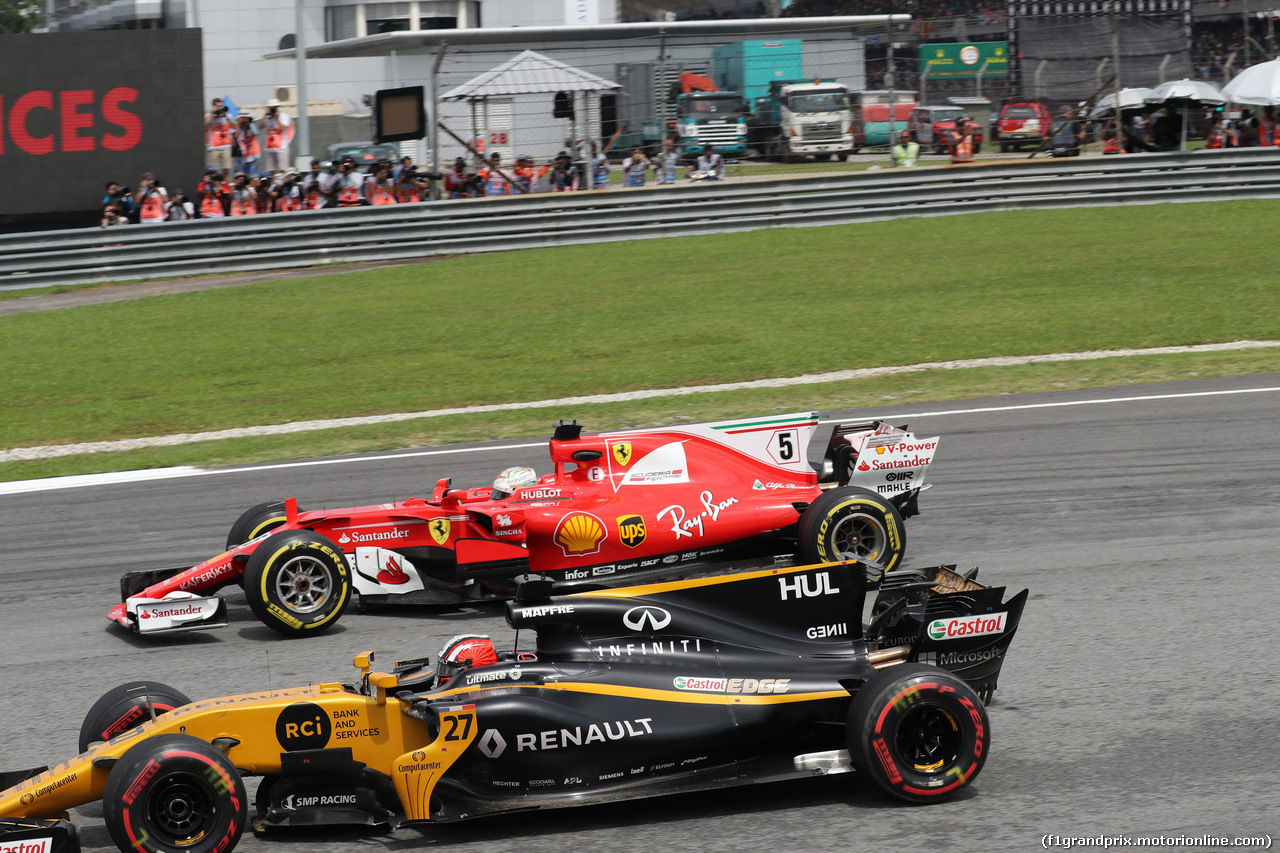 GP MALESIA, 01.10.2017 - Gara, Nico Hulkenberg (GER) Renault Sport F1 Team RS17 e Sebastian Vettel (GER) Ferrari SF70H