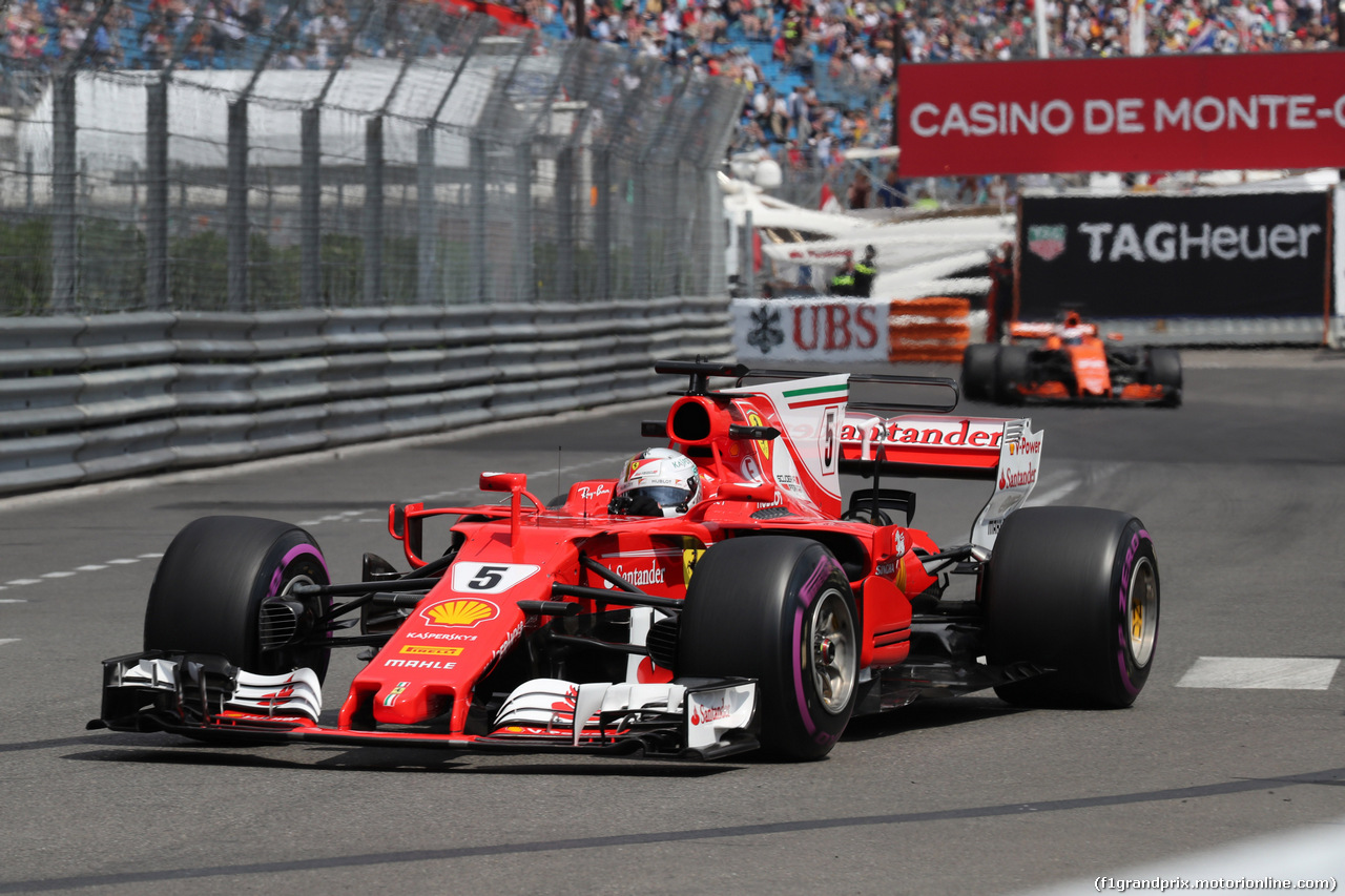 GP MONACO, 25.05.2017 - Prove Libere 1, Sebastian Vettel (GER) Ferrari SF70H e Jenson Button (GBR) McLaren MCL32