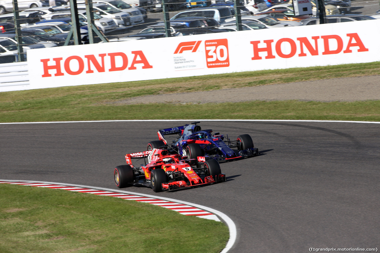 GP GIAPPONE, 07.10.2018 - Gara, Sebastian Vettel (GER) Ferrari SF71H e Brendon Hartley (NZL) Scuderia Toro Rosso STR13