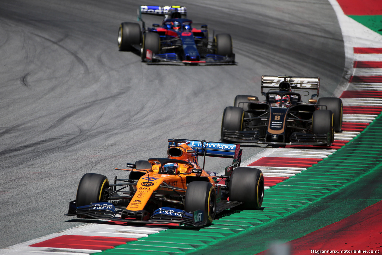 GP AUSTRIA, 30.06.2019 - Gara, Carlos Sainz Jr (ESP) Mclaren F1 Team MCL34 e Romain Grosjean (FRA) Haas F1 Team VF-19