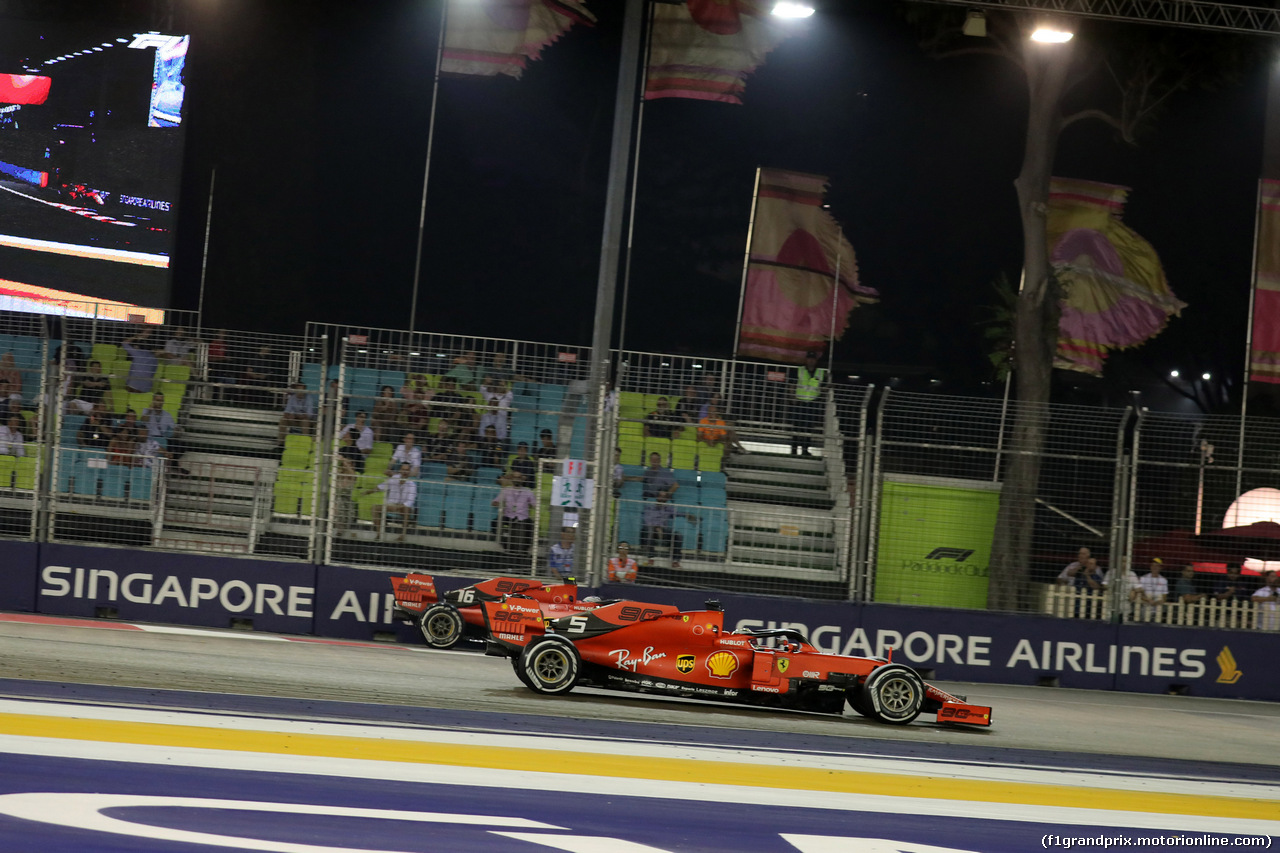 GP SINGAPORE, 22.09.2019 - Gara, Sebastian Vettel (GER) Ferrari SF90 pass Charles Leclerc (MON) Ferrari SF90
