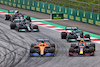 GP AUSTRIA, Lando Norris (GBR) McLaren MCL35M e Sergio Perez (MEX) Red Bull Racing RB16B battle for position.
04.07.2021. Formula 1 World Championship, Rd 9, Austrian Grand Prix, Spielberg, Austria, Gara Day.
- www.xpbimages.com, EMail: requests@xpbimages.com © Copyright: Charniaux / XPB Images