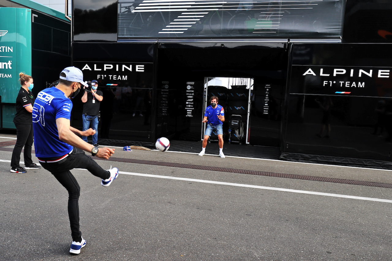 GP STIRIA, Esteban Ocon (FRA) Alpine F1 Team plays football in the paddock with team mate Fernando Alonso (ESP) Alpine F1 Team.
24.06.2021. Formula 1 World Championship, Rd 8, Steiermark Grand Prix, Spielberg, Austria, Preparation Day.
- www.xpbimages.com, EMail: requests@xpbimages.com © Copyright: Moy / XPB Images