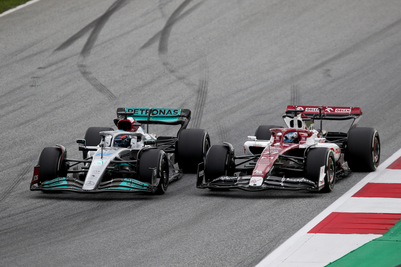 GP AUSTRIA, George Russell (GBR) Mercedes AMG F1 W13 e Valtteri Bottas (FIN) Alfa Romeo F1 Team C42 battle for position.
10.07.2022. Formula 1 World Championship, Rd 11, Austrian Grand Prix, Spielberg, Austria, Gara Day.
 - www.xpbimages.com, EMail: requests@xpbimages.com © Copyright: Coates / XPB Images