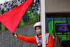 GP GIAPPONE, Circuit Atmosfera - a marshal waves a red flag.
09.10.2022. Formula 1 World Championship, Rd 18, Japanese Grand Prix, Suzuka, Japan, Gara Day.
 - www.xpbimages.com, EMail: requests@xpbimages.com © Copyright: Coates / XPB Images