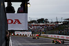 GP GIAPPONE, Charles Leclerc (MON) Ferrari F1-75 finishes the race on track ahead of Sergio Perez (MEX) Red Bull Racing RB18.
09.10.2022. Formula 1 World Championship, Rd 18, Japanese Grand Prix, Suzuka, Japan, Gara Day.
 - www.xpbimages.com, EMail: requests@xpbimages.com © Copyright: Coates / XPB Images