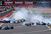 GP GRAN BRETAGNA, Guanyu Zhou (CHN) Alfa Romeo F1 Team C42; George Russell (GBR) Mercedes AMG F1 W13; e Alexander Albon (THA) Williams Racing FW44 crashed at the partenza of the race.
03.07.2022. Formula 1 World Championship, Rd 10, British Grand Prix, Silverstone, England, Gara Day.
- www.xpbimages.com, EMail: requests@xpbimages.com © Copyright: Batchelor / XPB Images