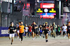 GP SINGAPORE, Circuit Atmosfera - fans run to the podium.
02.10.2022. Formula 1 World Championship, Rd 17, Singapore Grand Prix, Marina Bay Street Circuit, Singapore, Gara Day.
- www.xpbimages.com, EMail: requests@xpbimages.com © Copyright: Moy / XPB Images
