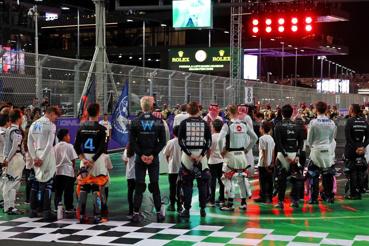 GP ARABIA SAUDITA, Drivers as the grid observes the national anthem.

19.03.2023. Formula 1 World Championship, Rd 2, Saudi Arabian Grand Prix, Jeddah, Saudi Arabia, Gara Day.

 - www.xpbimages.com, EMail: requests@xpbimages.com © Copyright: Coates / XPB Images