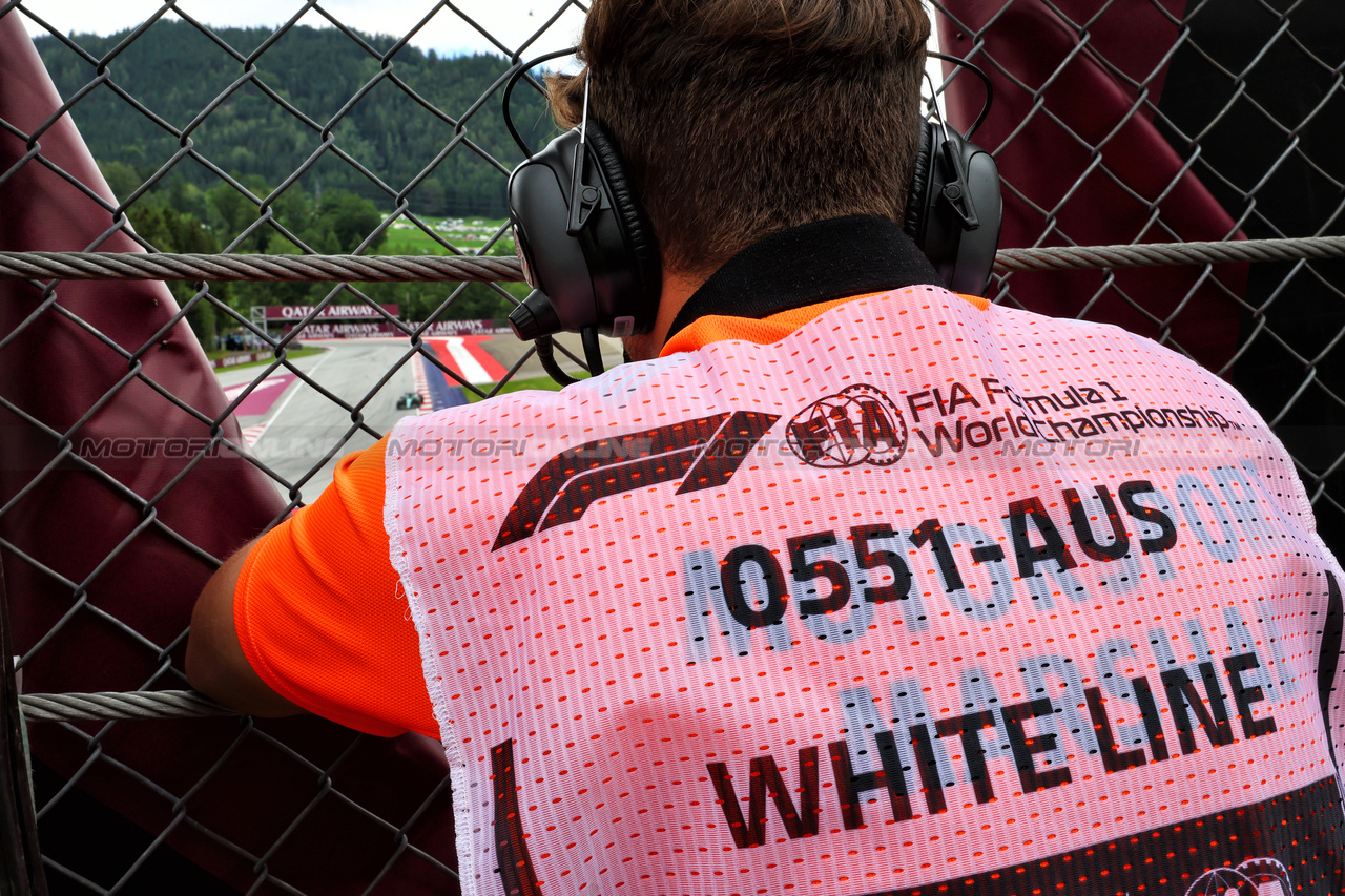 GP AUSTRIA, Circuit Atmosfera - White line track limits spotter. 

02.07.2023. Formula 1 World Championship, Rd 10, Austrian Grand Prix, Spielberg, Austria, Gara Day.

- www.xpbimages.com, EMail: requests@xpbimages.com © Copyright: Batchelor / XPB Images