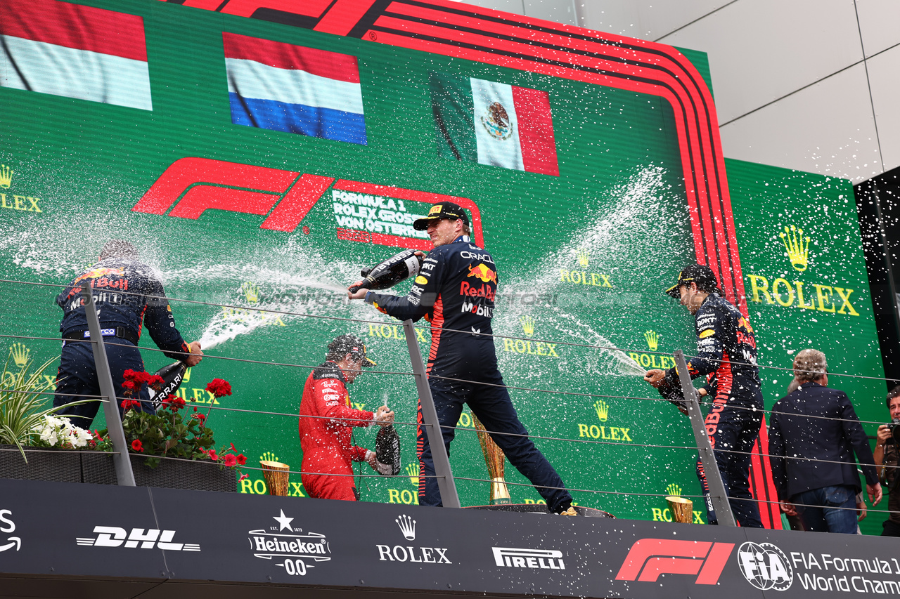 GP AUSTRIA, 
2nd place Charles Leclerc (MON) Ferrari F1-23 with Phil Turner (GBR) Red Bull Racing Chief Mechanic Representing Red Bull, 1st place Max Verstappen (NLD) Red Bull Racing e 3rd place Sergio Perez (MEX) Red Bull Racing RB19. 02.07.2023. Formula 1 World Championship, Rd 10, Austrian Grand Prix, Spielberg, Austria, Gara Day. - www.xpbimages.com, EMail: requests@xpbimages.com © Copyright: Batchelor / XPB Images