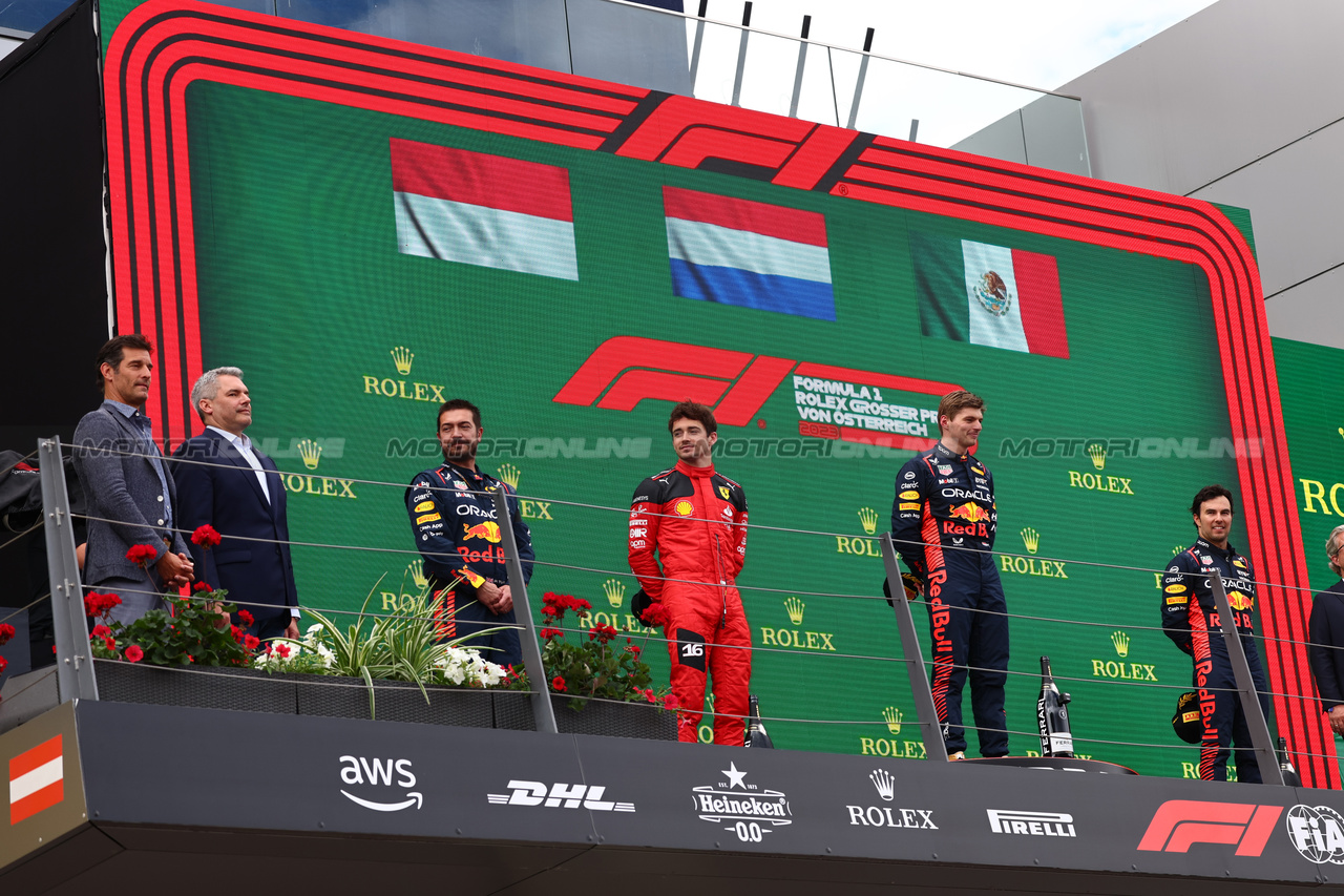 GP AUSTRIA, 
2nd place Charles Leclerc (MON) Ferrari F1-23 with Phil Turner (GBR) Red Bull Racing Chief Mechanic Representing Red Bull, 1st place Max Verstappen (NLD) Red Bull Racing e 3rd place Sergio Perez (MEX) Red Bull Racing RB19. 02.07.2023. Formula 1 World Championship, Rd 10, Austrian Grand Prix, Spielberg, Austria, Gara Day. - www.xpbimages.com, EMail: requests@xpbimages.com © Copyright: Batchelor / XPB Images