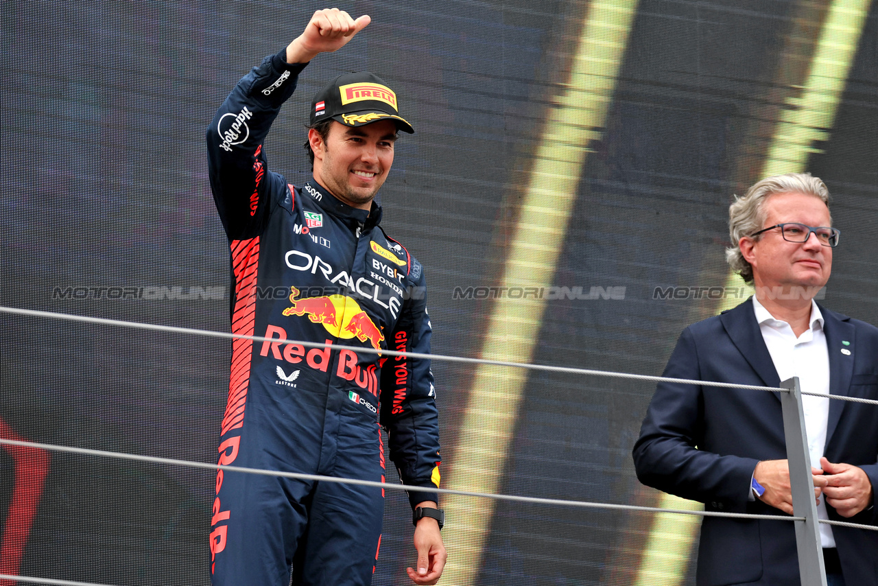 GP AUSTRIA, Sergio Perez (MEX) Red Bull Racing celebrates his third position on the podium.

02.07.2023. Formula 1 World Championship, Rd 10, Austrian Grand Prix, Spielberg, Austria, Gara Day.

- www.xpbimages.com, EMail: requests@xpbimages.com © Copyright: Moy / XPB Images