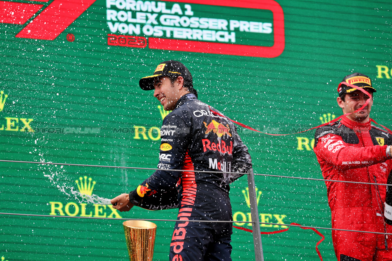 GP AUSTRIA, Sergio Perez (MEX) Red Bull Racing celebrates his third position on the podium.

02.07.2023. Formula 1 World Championship, Rd 10, Austrian Grand Prix, Spielberg, Austria, Gara Day.

- www.xpbimages.com, EMail: requests@xpbimages.com © Copyright: Moy / XPB Images